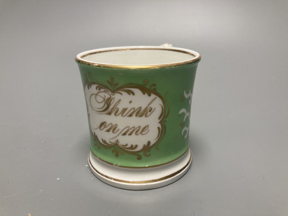 Two Meissen onion pattern shell-shaped dishes, width 19cm, and an English porcelain cabinet cup, inscribed in gilt, Think on me